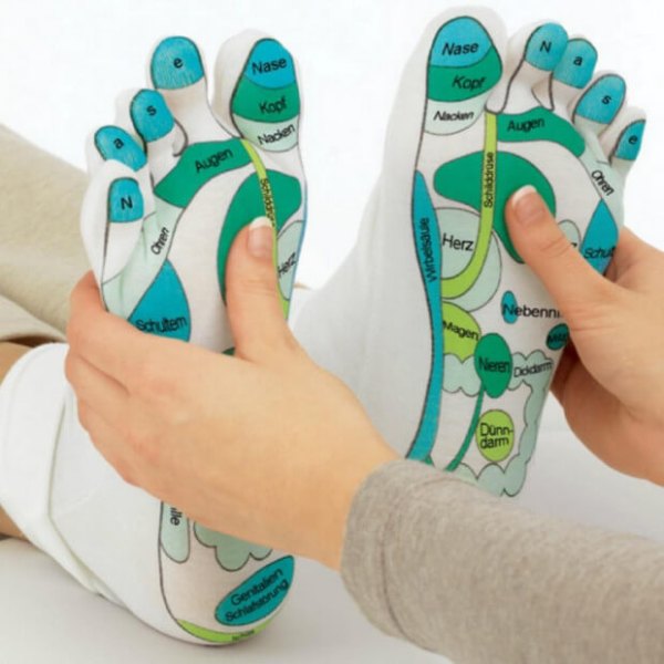 Chaussettes de réflexologie avec les zones du pied indiquées en français