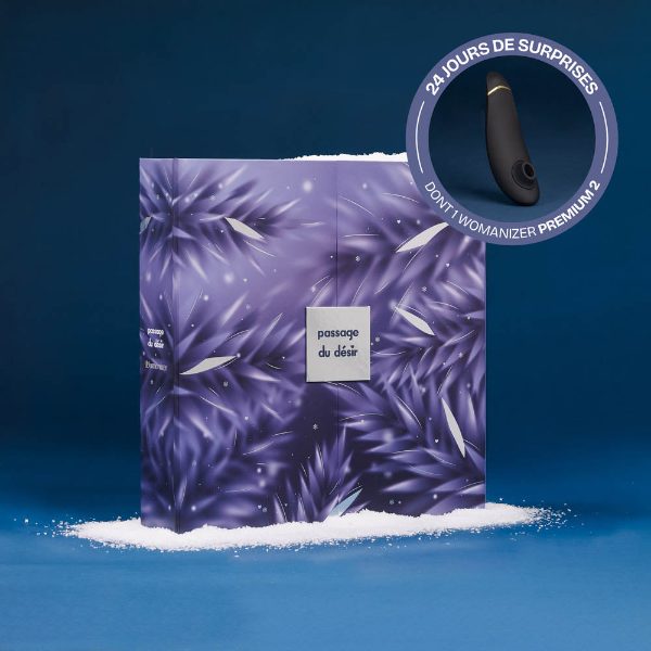 Coffret violet du calendrier de l'Avent Passage du Désir x Womanizer Premium 2026, avec le Womanizer Premium 2 en médaillon
